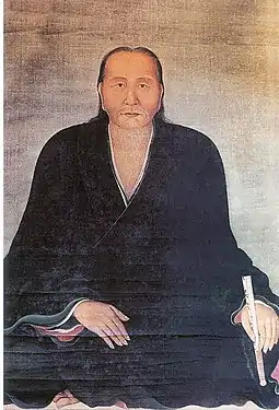 Portrait of Nguyễn Quý Đức in Đàng Ngoài. He was wearing a áo tràng vạt (cross-collared robe) and had loose long hair.