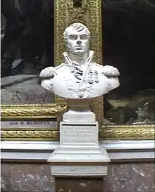 Bust of man with a dimple on his chin. He wears an early 1800s military uniform with high collar.