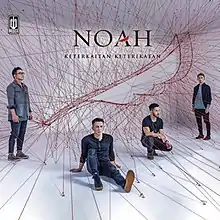 Noah posing between red strings that are connected to feather-shaped Noah logo in a white room. Words "Noah" and "Keterkaitan Keterikatan" written above the logo.