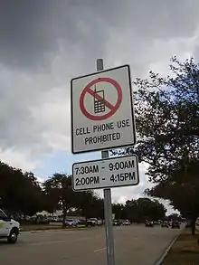 Image 5A sign in the US restricting cell phone use to certain times of day (no cell phone use between 7:30–9:00 am and 2:00–4:15 pm) (from Mobile phone)