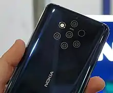 Image 56The Nokia 9 PureView features a five-lens camera array with Zeiss optics, using a mixture of color and monochrome sensors. (from Smartphone)