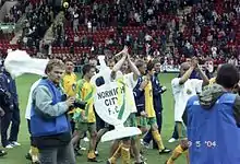 Norwich City players celebrate promotion to the FA Premiership at the end of the 2003/04