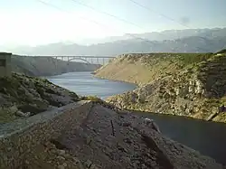 Reinforced concrete arch bridge across Novsko Ždrilo strait near Maslenica.