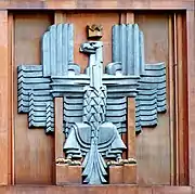 Polish coat of arms (unofficial) on the façade of the post office in Warsaw, Julian Puterman-Sadłowski, architect (1934)