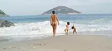 Naked mother and children at the Abricó beach