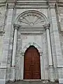 Central entrance to the courtyard, with sun motif above the doorway