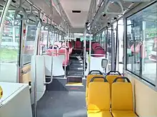 Image 217Interior of a wheelchair-accessible transit bus, with bucket seats and smart-card readers at the exit. (from Transit bus)