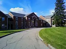 Picture of a building with a road leading up to it