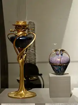 Oil lamp (left) by Tony Selmersheim c. 1898 beside vase by Maurice Dufrêne