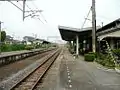 A view of the platforms and tracks. Note what appears to be the trackbed of a former track next to the platform to the left.