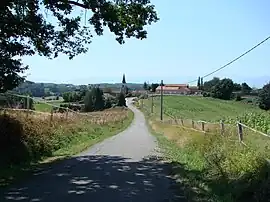 Entrance to the village church on the left, right school