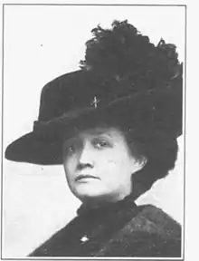 A black and white photograph of a woman, Ola Delight Smith, shot from the chest up, wearing a hat