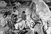 An aged and abandoned Muslim couple and their grandchildren are sitting by the roadside on this arduous journey. "The old man is dying of exhaustion. The caravan has gone on," wrote Bourke-White.