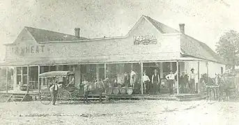 The original J.J. Putnam's general merchandise store, which later burned down and was replaced with a cement block building, which still stands on the southeast corner of Pickens Road and Curtis Avenue. This photo antedates 1914.