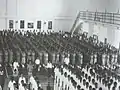 Flag raising ceremony in the hall at the old NYJC campus in 1980.