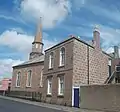 View of the church's southern side from Maiden Street. The church hall, built in 1896, is in the foreground