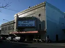 Old front of the theater with triangular marquee above the entrance