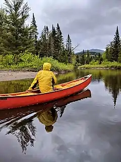 A canoeist on the Opalescent River near its confluence with the Hudson River (GPS 44.018172, -74.052487).