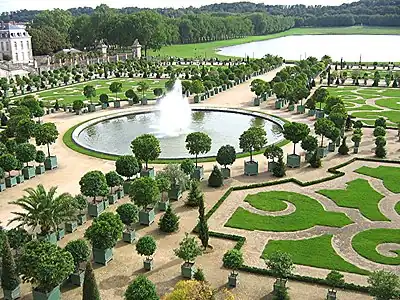 Image 38The Orangerie in the Gardens of Versailles with the Pièce d’eau des Suisses in the background (French formal garden) (from List of garden types)