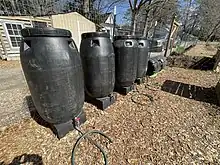 Organic Liquid fertilizer can be produced by adding green biomass to tanks of water, adding leaf mold, and then allowing anaerobic fermentation and decay to occur.  The microbes break down nutrients in the biomass which can then be used to fertilize garden plants.