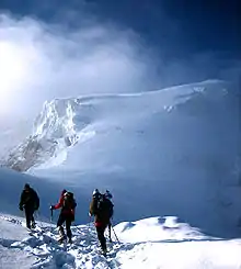 Image 14Mountaineers proceed across snow fields on South Tyrol; other climbers are visible further up the slopes. (from Mountaineering)