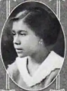 A young Black woman in an oval frame