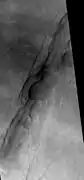 Oti Fossae, as seen by HiRISE.  Go to Fossa (geology) for more information.