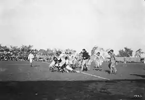 Image 31A game between the Hamilton Tigers and the Ottawa Rough Riders, 1910 (from Canadian football)