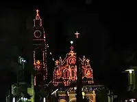 The basilica after dark decorated with lights on the feast day