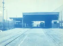 A large canopy over two streetcar tracks