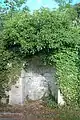 Stone niche with semicircular top, on road between preaching cross and former post office