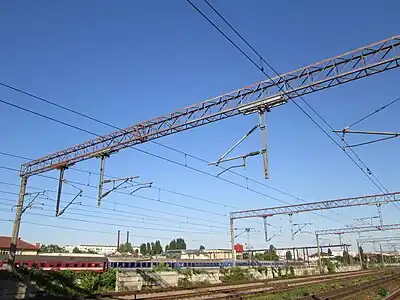 Gantry with old and new suspended equipment at Grivita railway station, Bucharest.