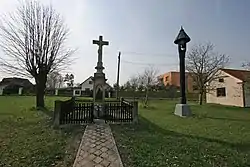 Cross and belfry in the centre of Přepychy