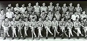 Portrait of military personnel standing or seated in three rows