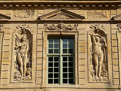 Allegorical bas-reliefs by Jean Goujon ; on the left, Fall, on the right, Winter.