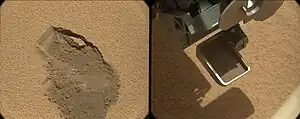 First use of Curiosity's scooper as it sifts a load of sand at Rocknest (October 7, 2012).