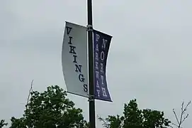 This banner in a parking lot facing Fee Fee Road features the colors of the school