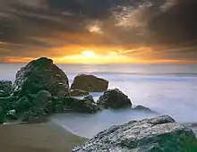 A photograph of a sunset at Point Dume beach in 2002.