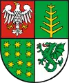 The coat of arms of the Ostrów County.