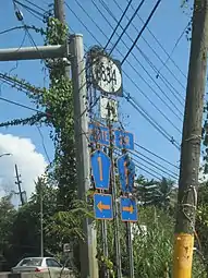 Signs for PR-1 and PR-8834 at the northern terminus of PR-173 in Río, Guaynabo