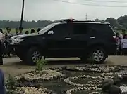 An unmarked Toyota Fortuner with a lightbar siren mounted on top of the SUV