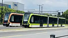 Two CRRC DRT vehicles at Feidu Road stop in 2023. Note that there are no physical tracks on the roadway.