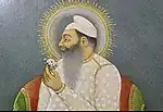 Painting of a nimbate Sardar Hamir Singh, sarder of the Phulkian Misl and founder of Nabha State, holding a flower and leaning on a bolster