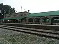 Stone railway station with a green roof