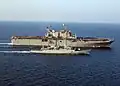 PNS Badr steams alongside USS Tarawa, an amphibious assault ship, in the Northern Persian Gulf, participating in the relief operation for the earthquake that struck the northern part of the Pakistan on 8 October 2005.