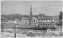 Image 7The National Palace burned down during the revolt against Salnave in 1868 (from History of Haiti)