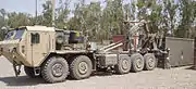 Oshkosh M1075A0 PLS truck fitted with the Armor Holdings developed protection package