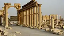 The Monumental Arch linking the east and central sections of the colonnade.