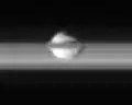 Equatorial view of Pan from Cassini, with the rings of Saturn surrounding the moon.