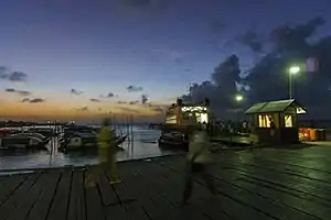 Parika Stelling (Harbour) with a ferry in the background